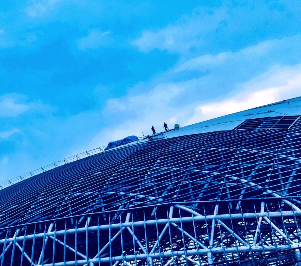 Construction workers on the roof of a construction site