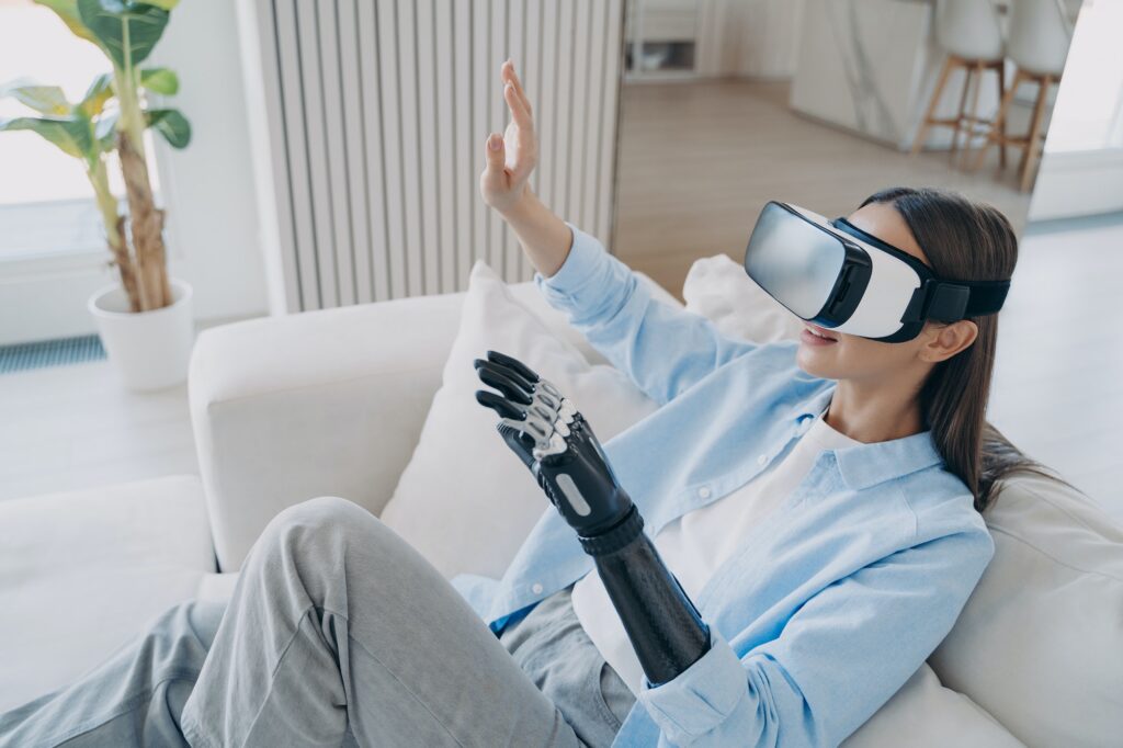 Excited lady touches 3d vision. Happy disabled european girl with artificial robotic arm.